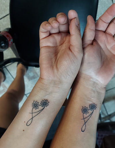 Explore stick and poke tattoo ideas, creative tattoo ideas in Rosenberg, available at Packers Tattoos