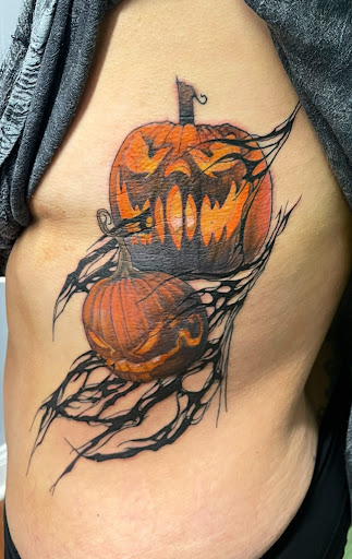 Explore love symbol tattoo ideas, creative tattoo ideas in Girard, available at Empress Tattoos FKA Treehouse Tattoo