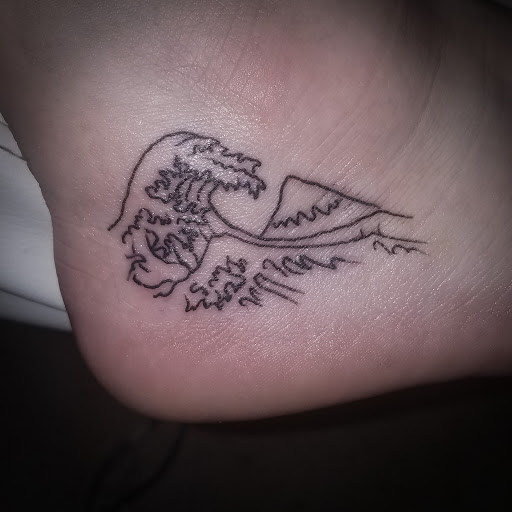 Explore lily flower tattoo ideas, creative tattoo ideas in Kingsport, available at Ink-a-zoid Tattoos & Piercings