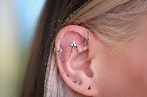 Explore female tattoo ideas ribs, creative tattoo ideas in Terre Haute, available at Piercings by Brett Rice - godpiercethequeen