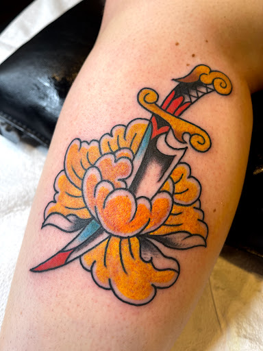 Explore female leg tattoo ideas, creative tattoo ideas in Johnson City, available at Gold Cross Tattoo Co.