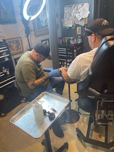 Find small cat tattoo ideas for your next unique tattoo in Fort Wayne at Grade A Tattoos and Body Piercing