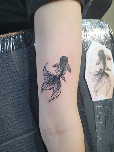 Explore name cover up tattoo ideas for men, creative tattoo ideas in Arlington, available at Lady Octopus Tattoos