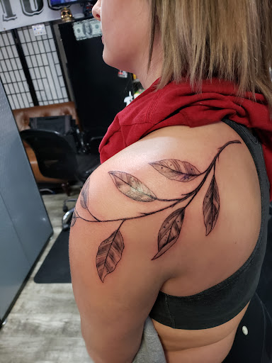 Explore chevy bowtie tattoo ideas, creative tattoo ideas in Linn Creek, available at Hillard Skillard Tattoos, LLC.