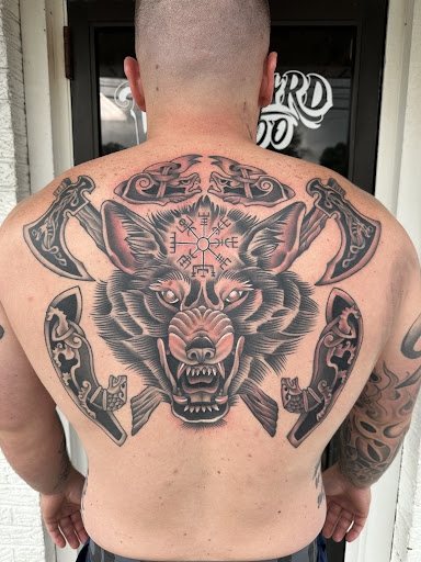 Explore tattoo sleeve filler ideas for a man, creative tattoo ideas in Erie, available at Wayward Tattoo Studio