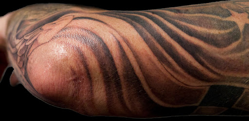 Explore world travel tattoo ideas, creative tattoo ideas in Dover, available at TATTOO MAFIA, INC.