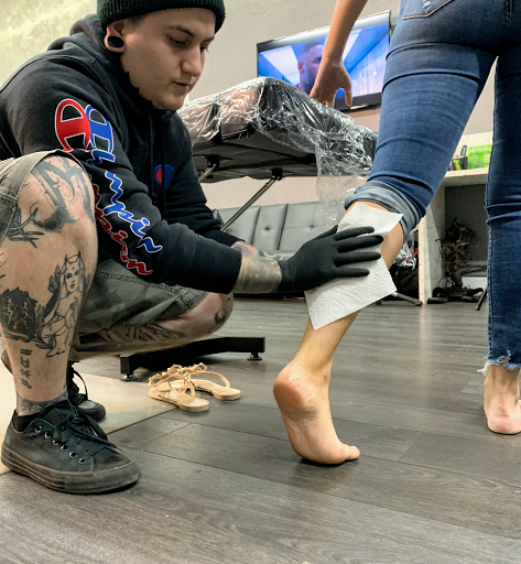 Explore ripped tattoo ideas, creative tattoo ideas in Hollywood, available at Sacred Eye Tattoos