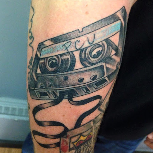 Explore ripped skin tattoo ideas, creative tattoo ideas in East Northport, available at Royalty Tattoo & Piercing