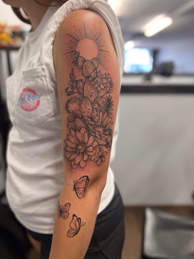 Explore flower tattoo ideas for guys, creative tattoo ideas in Wallace, available at Artistic Abyss Tattoo Collective