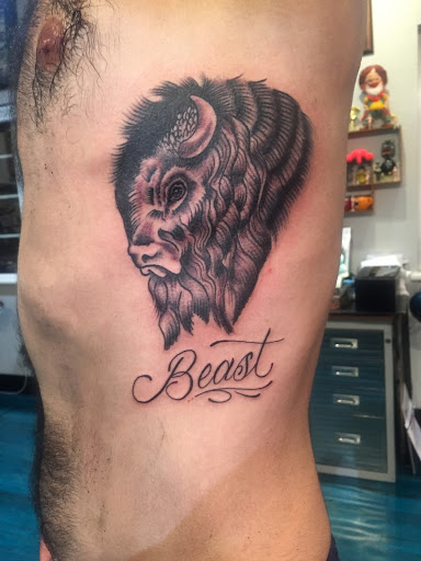 Explore inner bicep tattoo ideas for men, creative tattoo ideas in Reno, available at Aces Tattoo