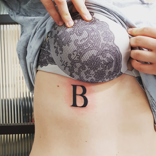 Find cute tattoo ideas for black females for your next unique tattoo in Bellevue at Skin and Soul Tattoo & Piercing