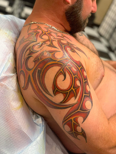 Explore floral arm sleeve tattoo ideas, creative tattoo ideas in Augusta, available at Mr. Tattoo