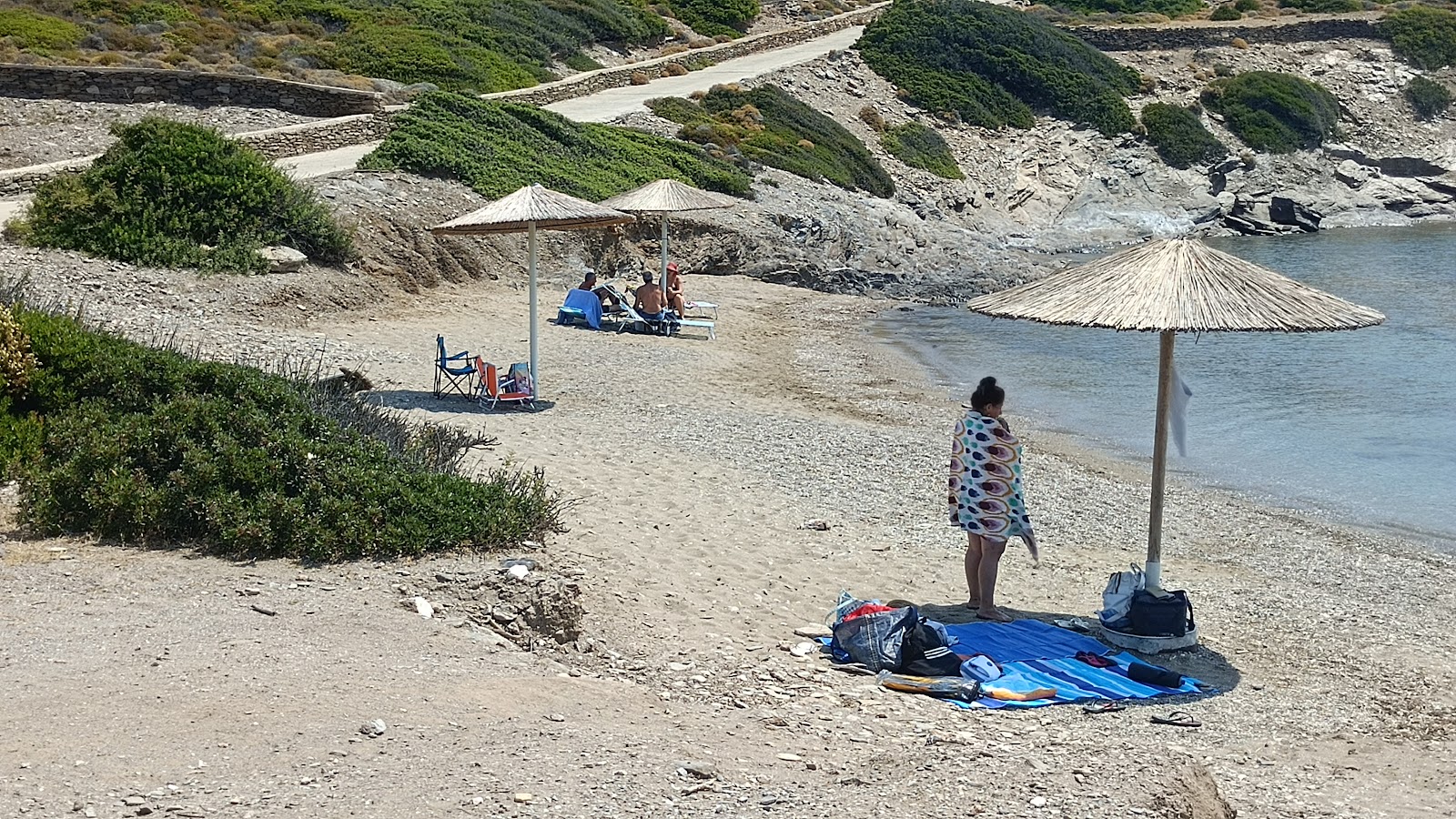 Fasoli Beach'in fotoğrafı düz bir kıyı şeridi ile birlikte