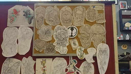 Find finger tattoo ideas for men for your next unique tattoo in Easton at Famous Tattoo Works