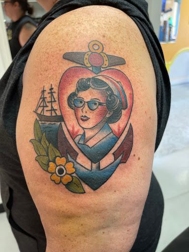 Explore apple tattoo ideas, creative tattoo ideas in Marietta, available at Monkeys Uncle Tattoo