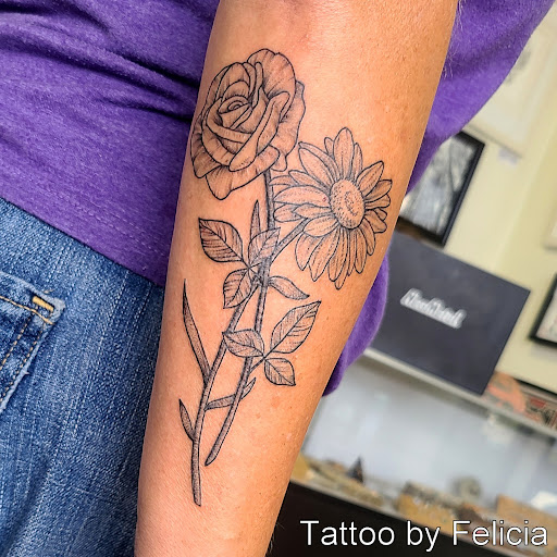 Explore male bicep tattoo ideas, creative tattoo ideas in Fort Myers, available at Tiger Lotus Tattoo and Piercing