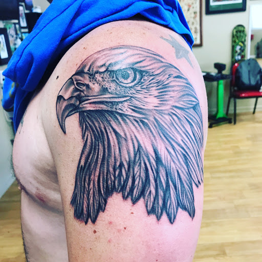 Explore lupus tattoo ideas, creative tattoo ideas in Liberty, available at Dark Lotus Tattoo & Salon