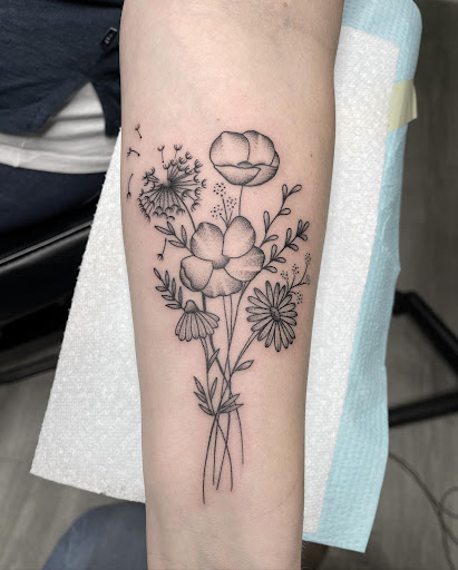 Explore tramp stamp lower back tattoo cover up ideas, creative tattoo ideas in Richlands, available at Down Yonder Tattoo