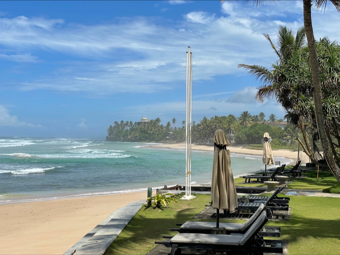 Foto van Dommannegoda Beach met turquoise puur water oppervlakte