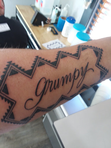 Explore neck tattoos for men ideas, creative tattoo ideas in Eureka, available at Primal Decor