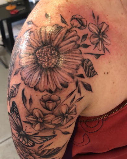 Explore tattoo scroll ideas, creative tattoo ideas in Kingston, available at Innovative Ink Tattoo & SMP