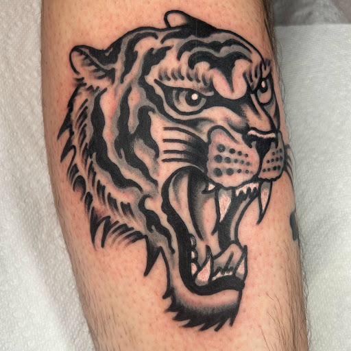 Find simple cat tattoo ideas for your next unique tattoo in Johnson City at Gold Cross Tattoo Co.