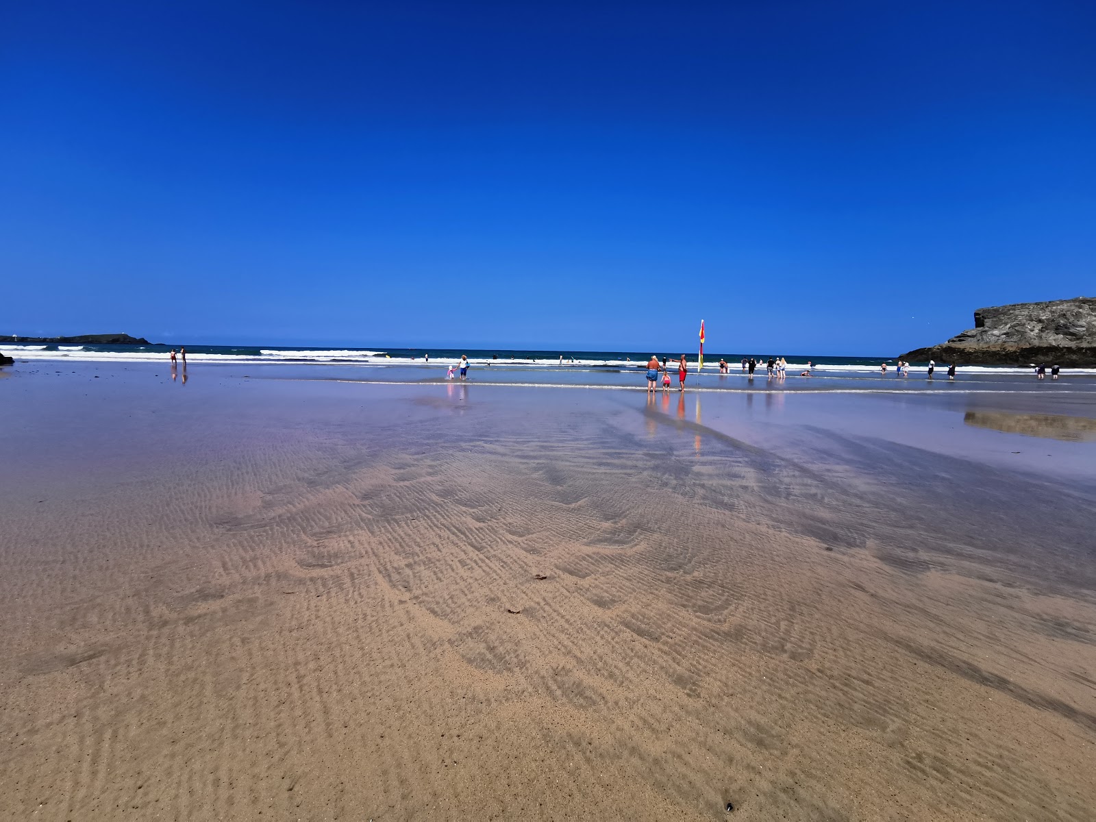 Photo of Porth Beach with long bay