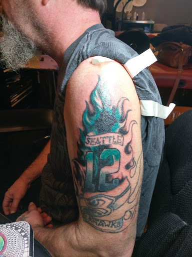 Explore red tattoo ideas women, creative tattoo ideas in Auburn, available at Action Tattoo