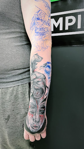 Explore blue flame tattoo ideas, creative tattoo ideas in Cadillac, available at Limitless Ink Tattoo Studio