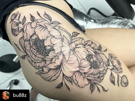 Explore thigh tattoo ideas for women, creative tattoo ideas in Murrieta, available at Diamond City Tattoo & Piercing