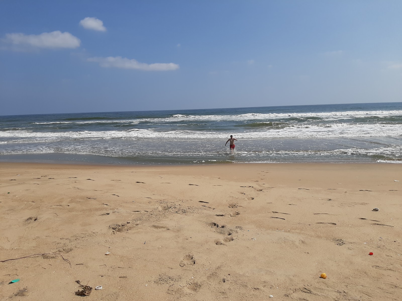 Foto di Olive Beach con costa lunga e dritta