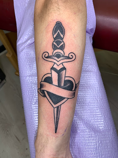 Explore tattoo ideas for guys with daughters, creative tattoo ideas in Arlington, available at Benchmark Tattoos