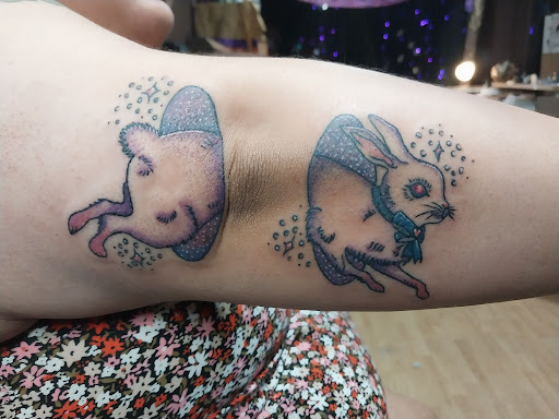 Explore rib tattoo ideas for women, creative tattoo ideas in Peckville, available at The Chaotic Cauldron Tattoos and More