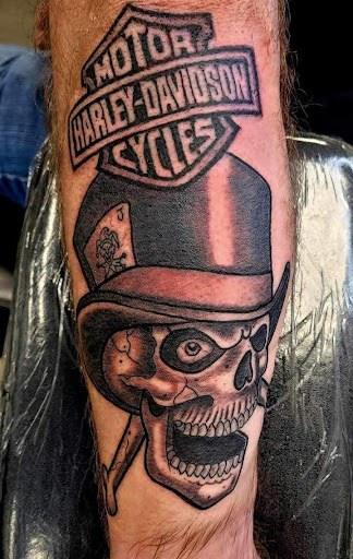 Explore skull neck tattoo ideas, creative tattoo ideas in Wallace, available at Artistic Abyss Tattoo Collective