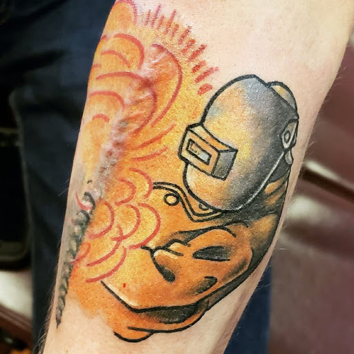 Explore wedding band tattoo ideas for him, creative tattoo ideas in Flint, available at Black Eye Social Club Tattoo