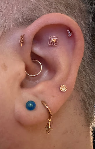 Explore behind ear tattoo ideas for guys, creative tattoo ideas in Roanoke, available at Sati Piercing & Fine Jewelry