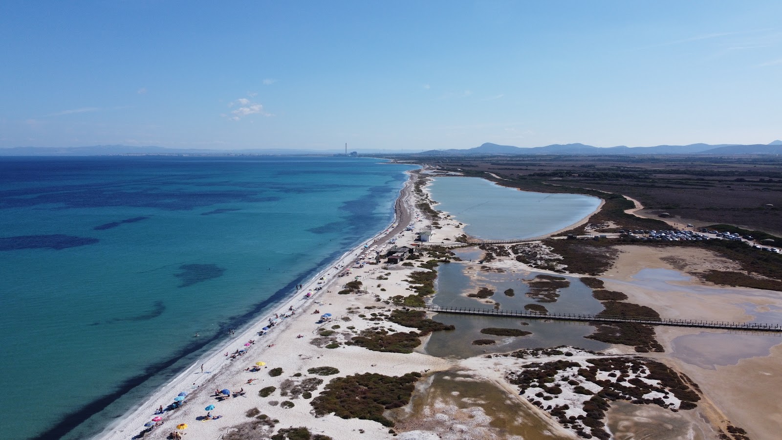 Spiaggia delle Saline'in fotoğrafı düz ve uzun ile birlikte