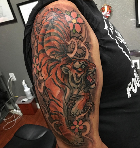 Explore rip neck tattoo ideas, creative tattoo ideas in Redwood City, available at Gods & Titans Tattoo