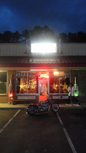 Explore guitar pick tattoo ideas, creative tattoo ideas in Anderson, available at FearlessTattoos and Piercing