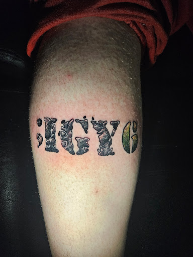 Explore dedication tattoo ideas, creative tattoo ideas in Angola, available at Hoodlum Ink