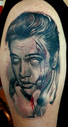 Explore under breast tattoo ideas for females, creative tattoo ideas in Sarasota, available at SEVEN SINS Tattoo Studio