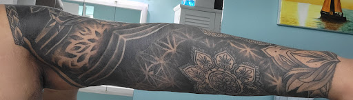 Explore cherry blossom tree tattoo ideas, creative tattoo ideas in Schaumburg, available at Urban Rebels Ink