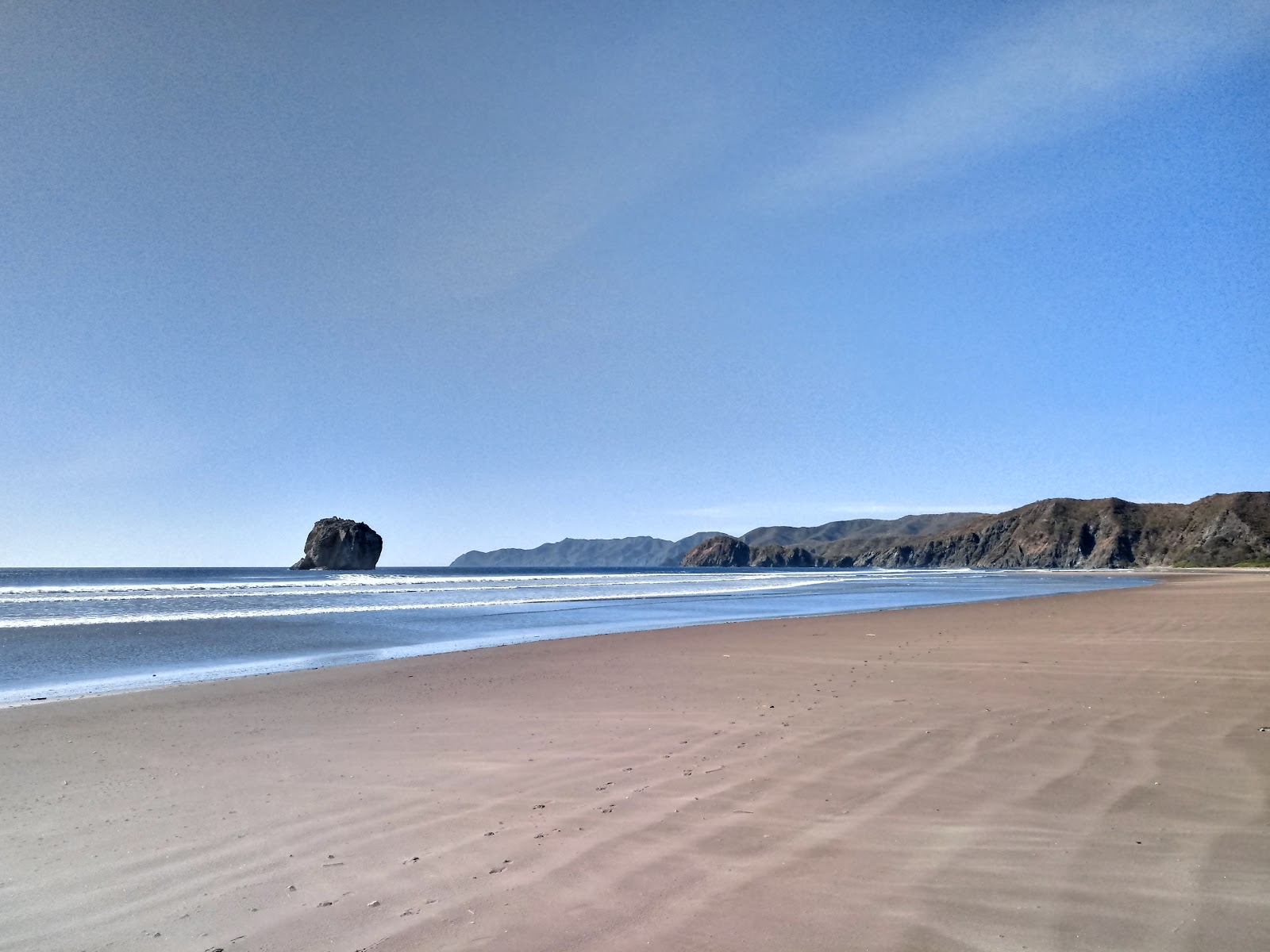 Photo of Naranjo beach with gray sand surface