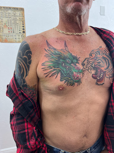 Explore tattoo ideas female thigh, creative tattoo ideas in Cocoa, available at Rorschach Tattoo Shop and Piercing Studio