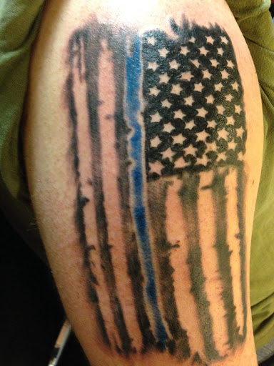 Explore song lyric tattoo ideas, creative tattoo ideas in Cheyenne, available at The T.R.I.B.E. Zoo, LLC Tattoo