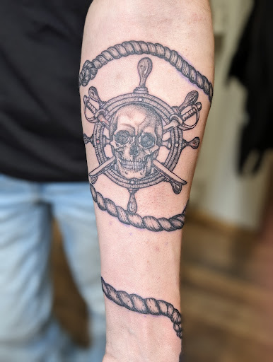 Explore dragon tattoo cover up ideas, creative tattoo ideas in Cornelia, available at Prismatic Pulse Tattoo
