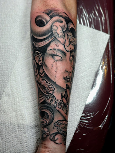 Explore caterpillar tattoo ideas, creative tattoo ideas in Fuquay Varina, available at 401 Tattoo and Antiquities