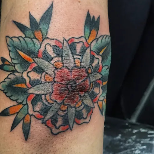 Explore dirtbike tattoo idea, creative tattoo ideas in Charlotte, available at Tattoos by Jamison