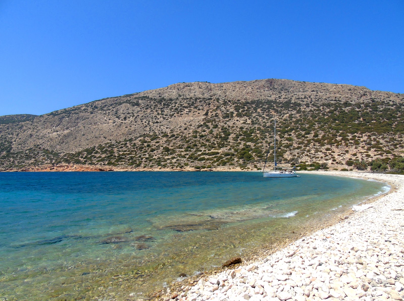 Photo of Alimia beach with rocks cover surface