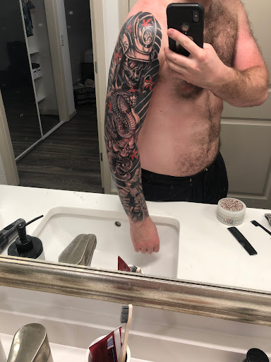 Explore tattoo ideas for men chest, creative tattoo ideas in Arlington, available at Fluid Ink Tattoo Studio